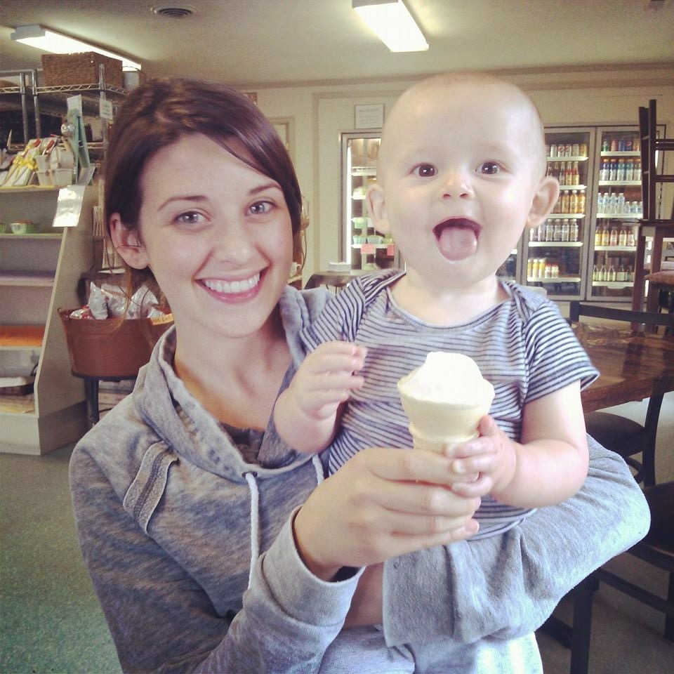 woman holding boy with an ice cream cone